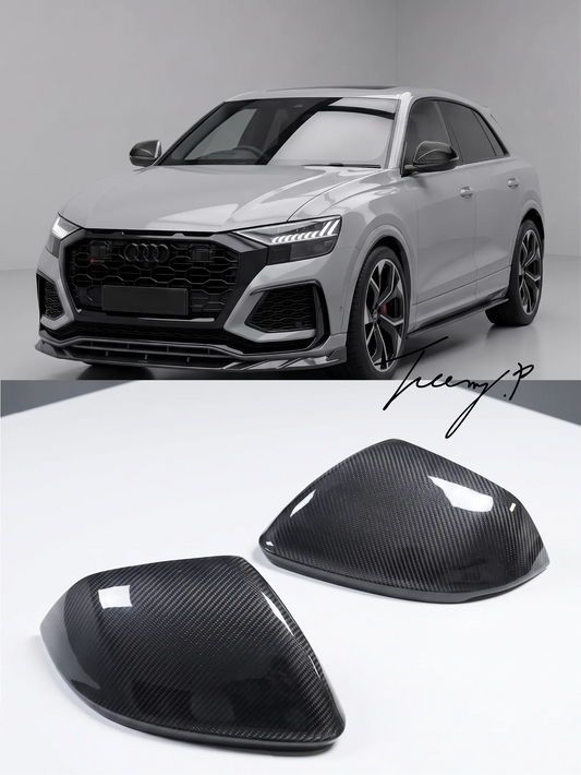 Carbon fiber GT style side mirror caps with camera hole cutouts installed on a 2020-2026 Audi RSQ8
