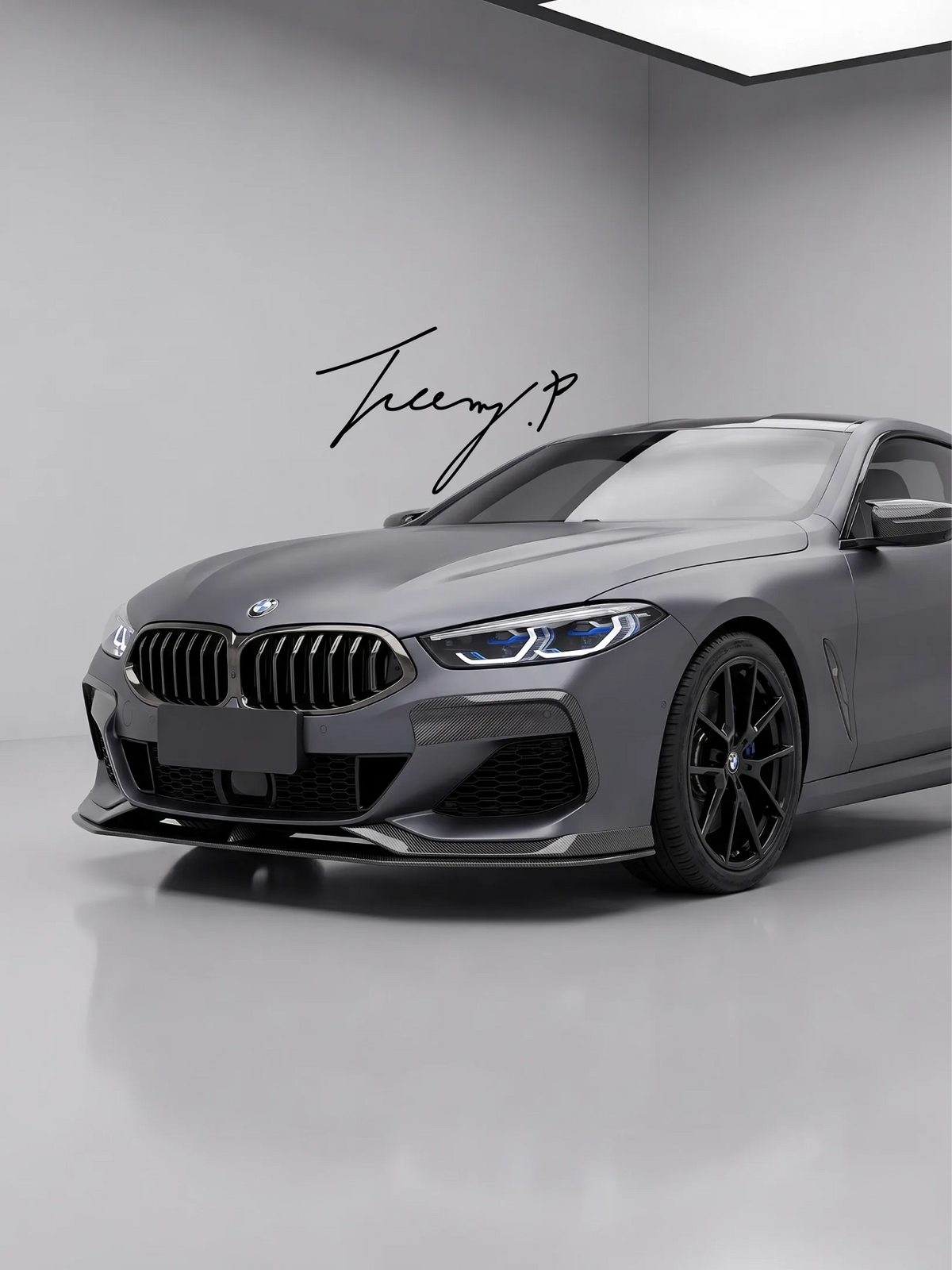 Carbon fiber-look ABS front lip splitter spoiler installed on a 2018-2021 BMW 8 Series M Sport G14 / G15 / G16