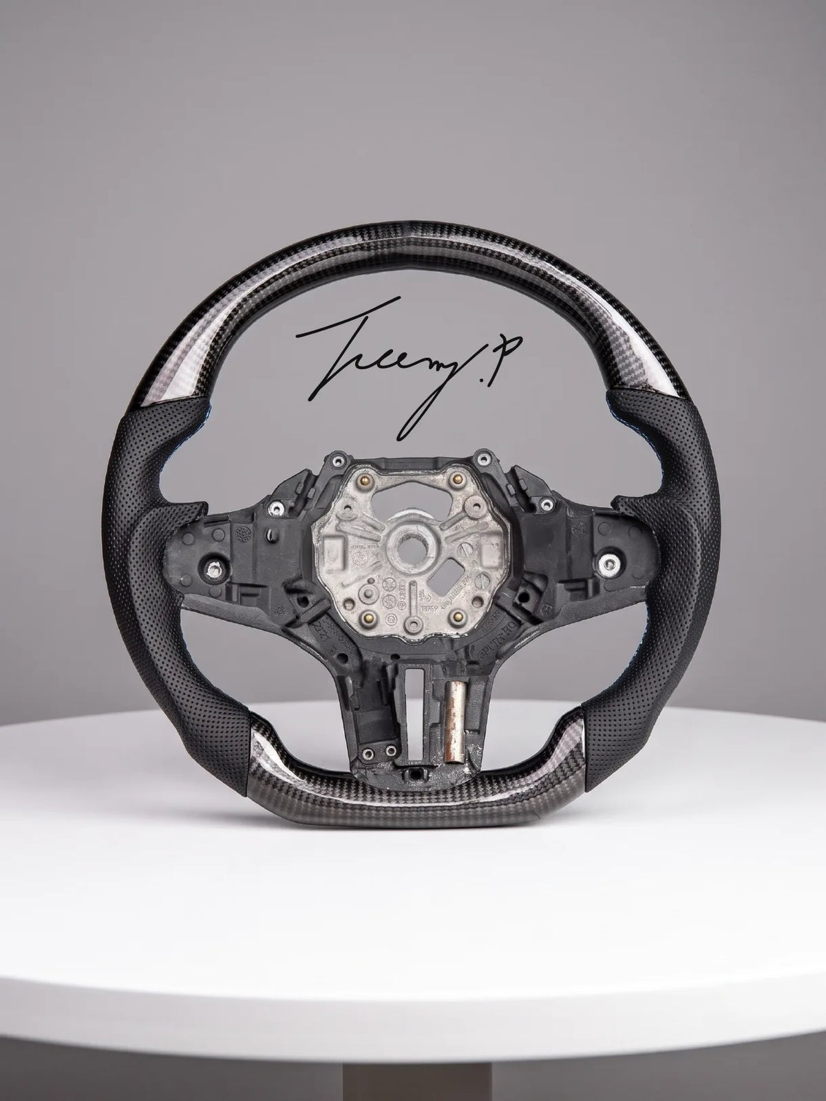 Carbon fiber heated performance steering wheel installed on a 2018-2024 BMW X1/X2 (F39), 5 Series (G30/G31), X3 (G01), X5 (G05), X6 (G06), X7 (G07), or M3 (G80)