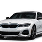 Front angle view of gloss black double-slat LED light bar kidney grille installed on a 2019 to 2022 BMW 3 Series G20.