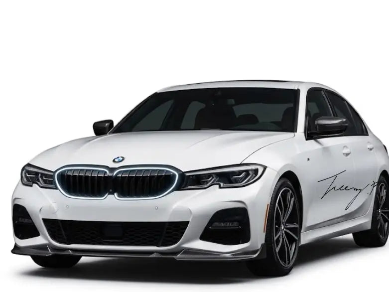 Front angle view of gloss black double-slat LED light bar kidney grille installed on a 2019 to 2022 BMW 3 Series G20.