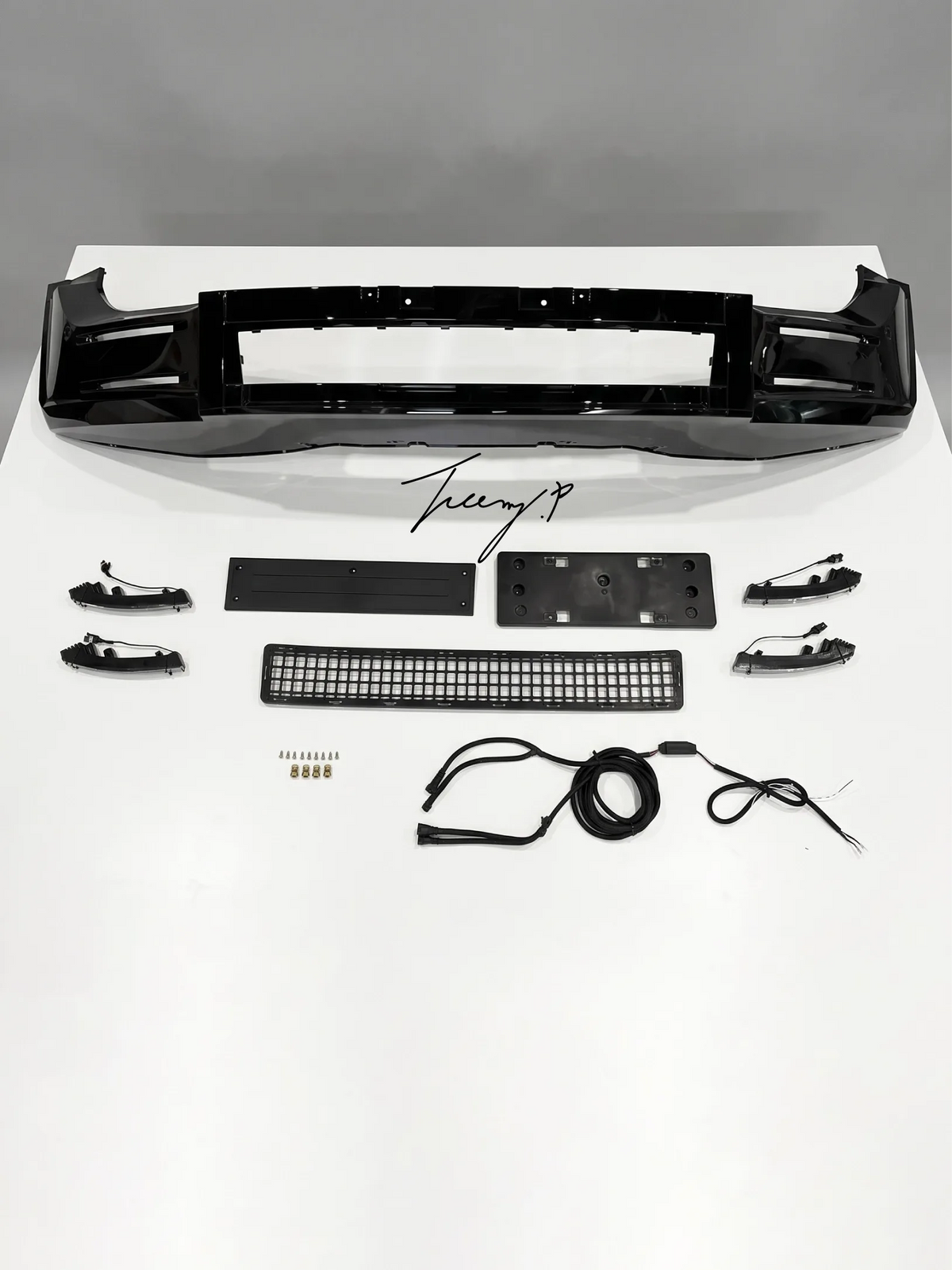 Gloss black front lip splitter lower bumper kit installed on a 2020-2025 Land Rover Defender L663