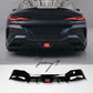 Gloss black rear bumper diffuser with integrated center LED light on a BMW 8 Series G16 Gran Coupe