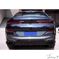 Gloss black rear bumper diffuser, lip splitters, and body kit installed on a 2019-2023 BMW X6 G06