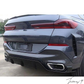 Gloss black rear bumper diffuser, lip splitters, and body kit installed on a 2019-2023 BMW X6 G06
