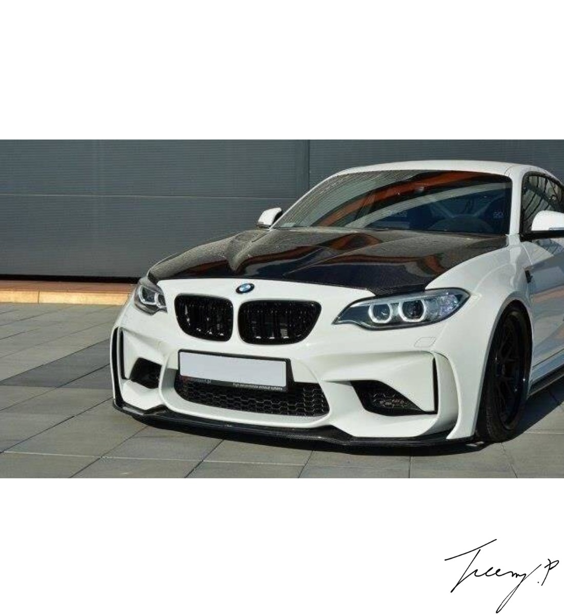 Carbon look front splitter, rear diffuser, side skirts, and trunk spoiler body kit installed on a 2016-2021 BMW M2 F87.