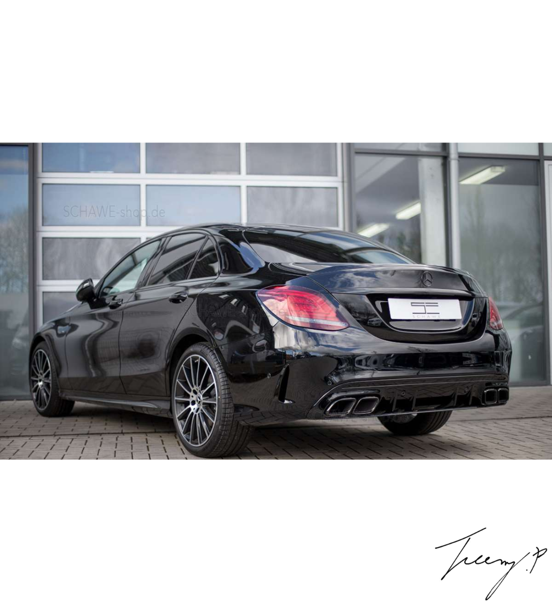Gloss black rear diffuser with AMG tailpipes installed on a 2015-2020 Mercedes C-Class AMG / C63 W205 Sedan