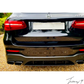 Gloss black GLC63 AMG style rear diffuser with quad exhaust tailpipes installed on a 2016-2019 Mercedes-Benz GLC-Class X253.