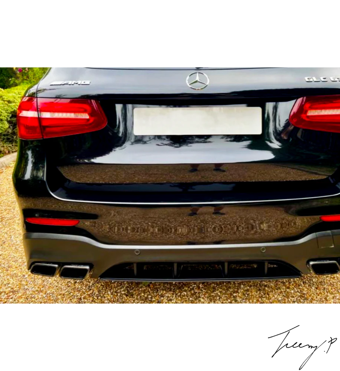 Gloss black GLC63 AMG style rear diffuser with quad exhaust tailpipes installed on a 2016-2019 Mercedes-Benz GLC-Class X253.