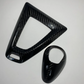 Real carbon fiber interior kit with handbrake handle and steering wheel trim installed on a 2014-2021 BMW M2 F87, M3 F80, or M4 F82