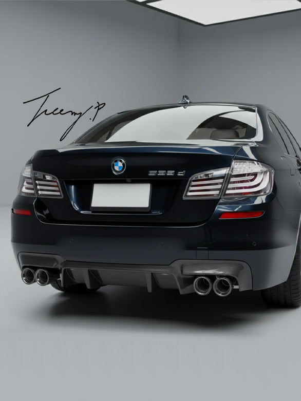 Carbon-look quad-exit rear diffuser installed on a 2010-2017 BMW 5 Series / M5 (F10 / F11) M Sport