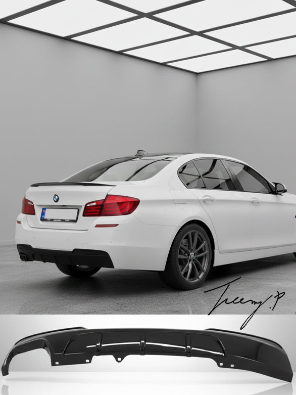 Gloss black twin-exit rear valance diffuser installed on a 2010-2017 BMW 5 Series (F10 / F11) M Sport