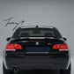 Gloss black rear valance diffuser spoiler installed on a 2006-2013 BMW 3 Series (E92 / E93) M Sport