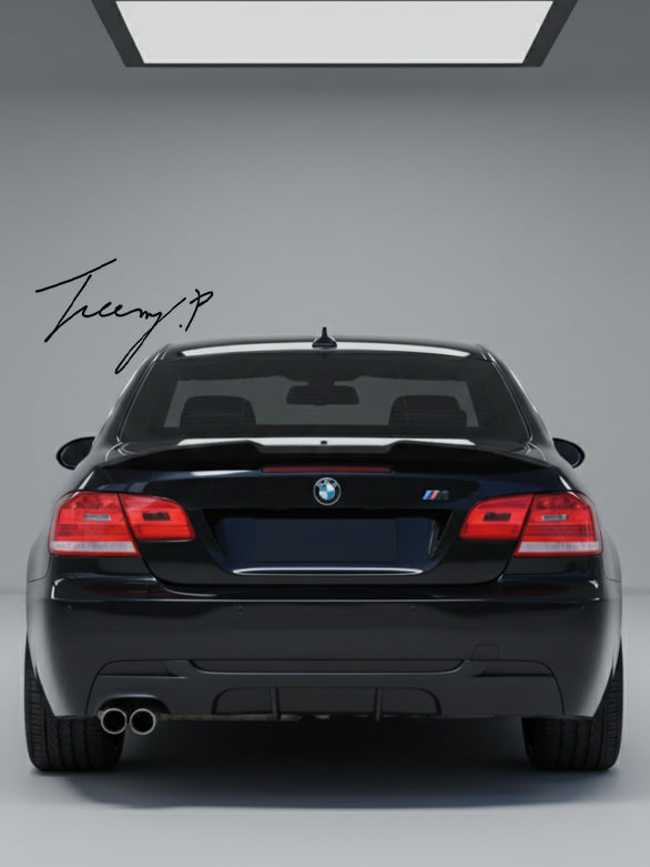 Gloss black rear valance diffuser spoiler installed on a 2006-2013 BMW 3 Series (E92 / E93) M Sport