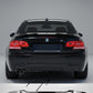 Gloss black rear valance diffuser spoiler installed on a 2006-2013 BMW 3 Series (E92 / E93) M Sport