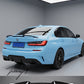Gloss black V-style rear boot spoiler lip wing installed on a 2018-2023 BMW 3 Series / M3 G20 / G80