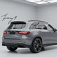 Gloss black GLC63 AMG style rear diffuser with quad exhaust tailpipes installed on a 2016-2019 Mercedes-Benz GLC-Class X253.