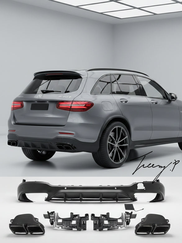 Gloss black GLC63 AMG style rear diffuser with quad exhaust tailpipes installed on a 2016-2019 Mercedes-Benz GLC-Class X253.