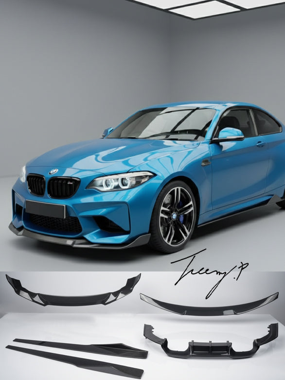 Carbon look front splitter, rear diffuser, side skirts, and trunk spoiler body kit installed on a 2016-2021 BMW M2 F87.