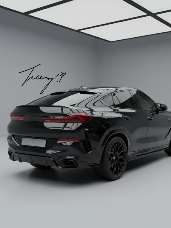 Gloss black rear bumper diffuser, lip splitters, and body kit installed on a 2019-2023 BMW X6 G06