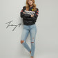 Black unisex leather-look Ferrari racing jacket with embroidered F1-style branding and hood.