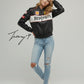 Black unisex leather-look Ferrari racing jacket with embroidered F1-style branding and hood.