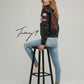 Black unisex leather-look Ferrari racing jacket with embroidered F1-style branding and hood.