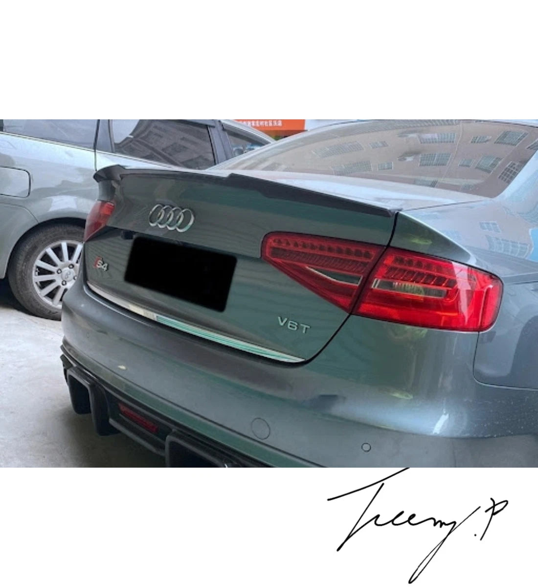 Gloss black M4-style rear boot spoiler lip installed on a 2009-2012 Audi A4 B8