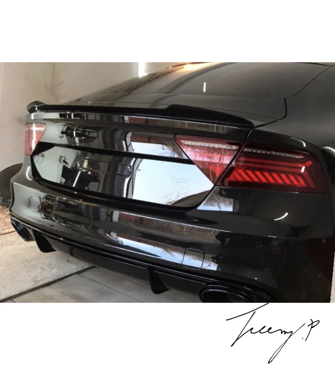 Gloss black rear boot trunk spoiler lip wing installed on a 2010-2018 Audi A7 Sedan (Sportback)
