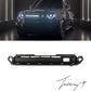 Gloss black front grille with integrated LED light installed on a 2020-2026 Land Rover Defender (L663)