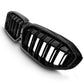 Front angle view of gloss black double-slat LED light bar kidney grille installed on a 2019 to 2022 BMW 3 Series G20.