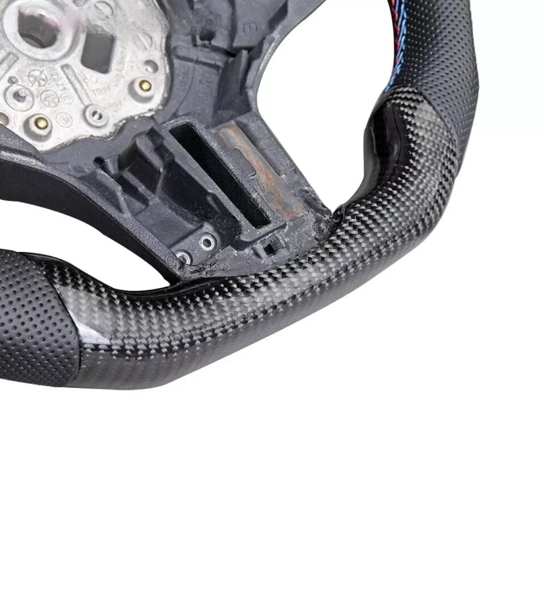 Carbon fiber heated performance steering wheel installed on a 2018-2024 BMW X3 (G01), X4 (G02), X5 (G05), or X6 (G06)